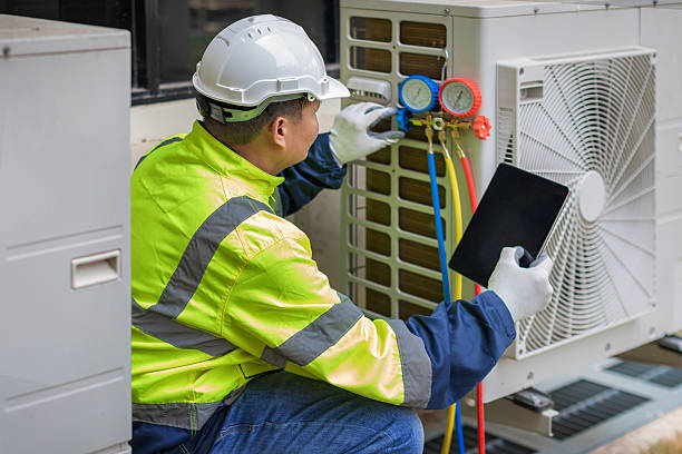 Professional Air Duct Cleaning technician working in Hudson, MI
